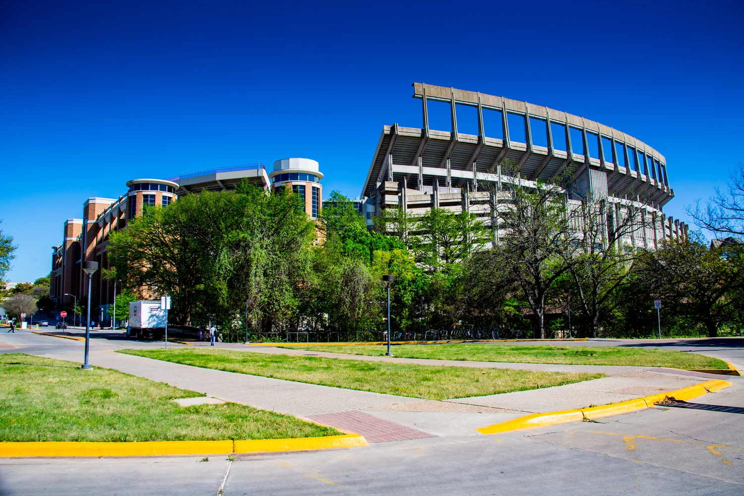 University of Texas at Austin campus grounds with students walking between academic buildings